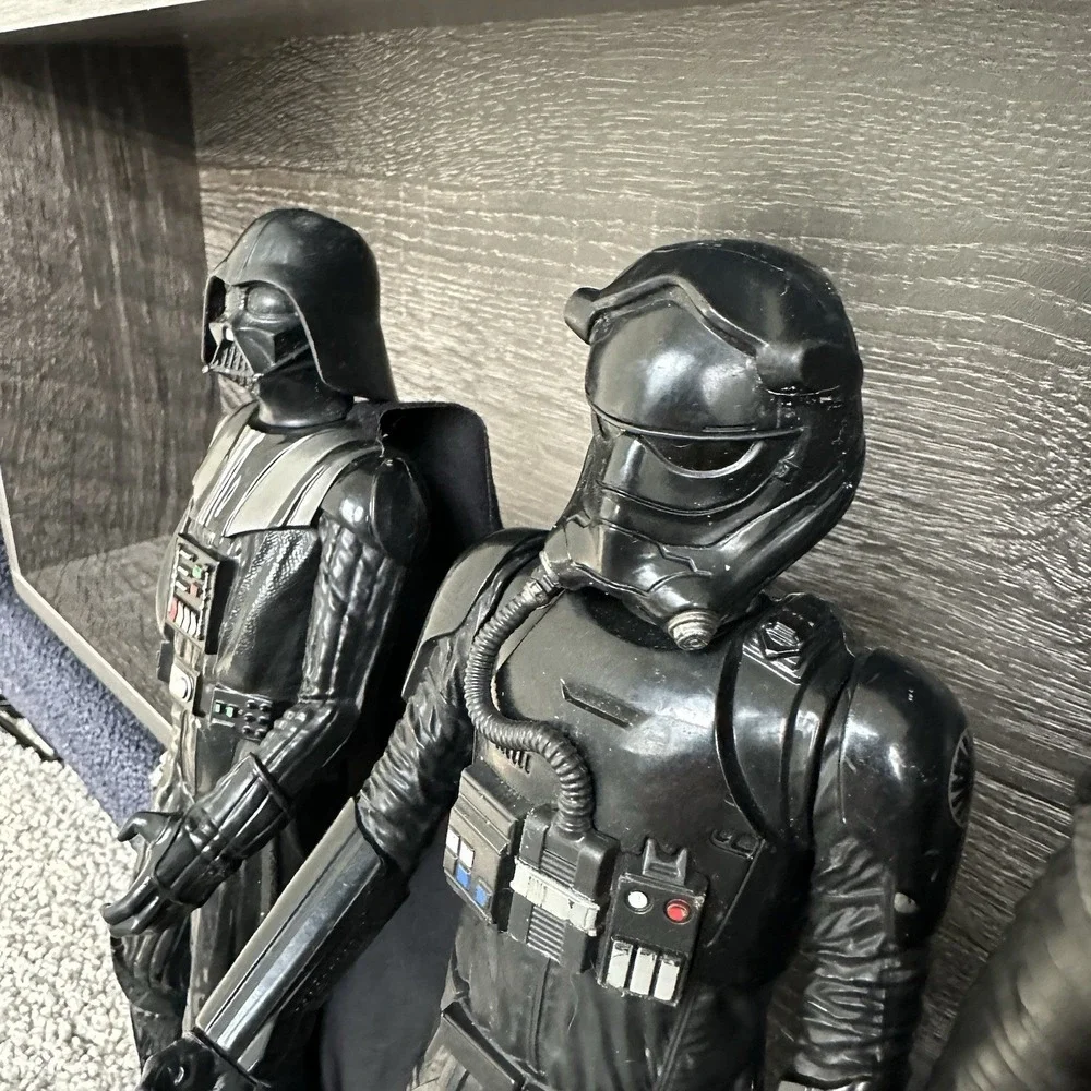 Star Wars action‎ figures Darth Vader, a TIE Fighter Pilot, Kylo Ren, and Finn